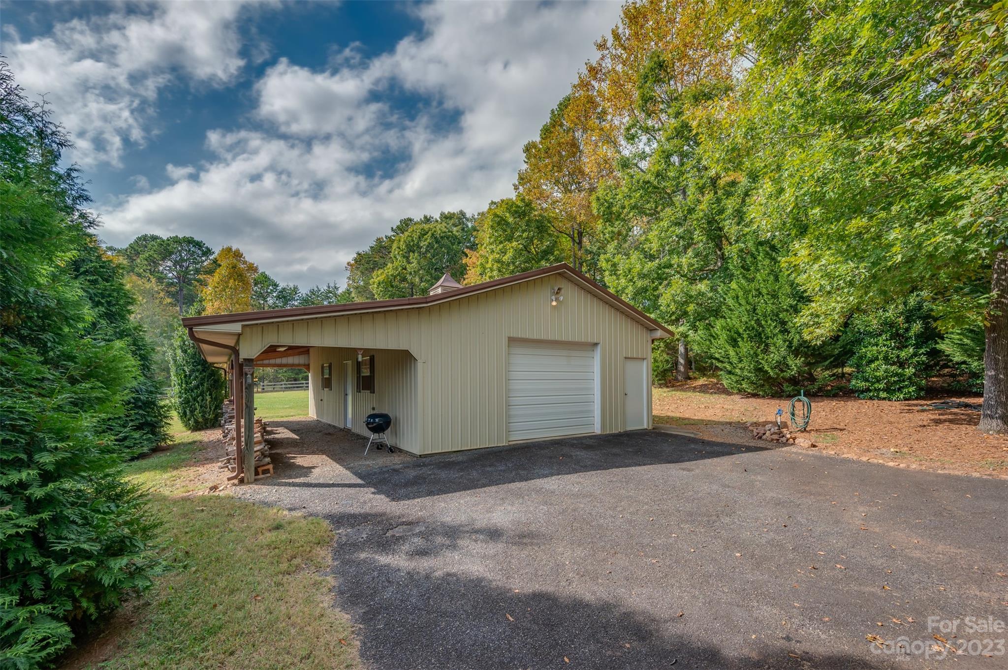 1389 Landrum Road Columbus, NC 28722 - Photo 45 of 46 a view of a house with backyard and trees