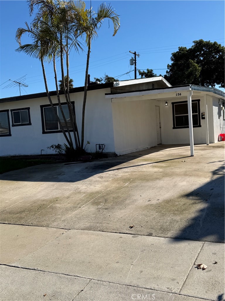 156 West 234th Street Carson, CA 90745 - Photo 3 of 9 a front view of a house with a garage