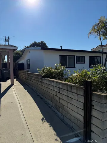 a house view with a garden space