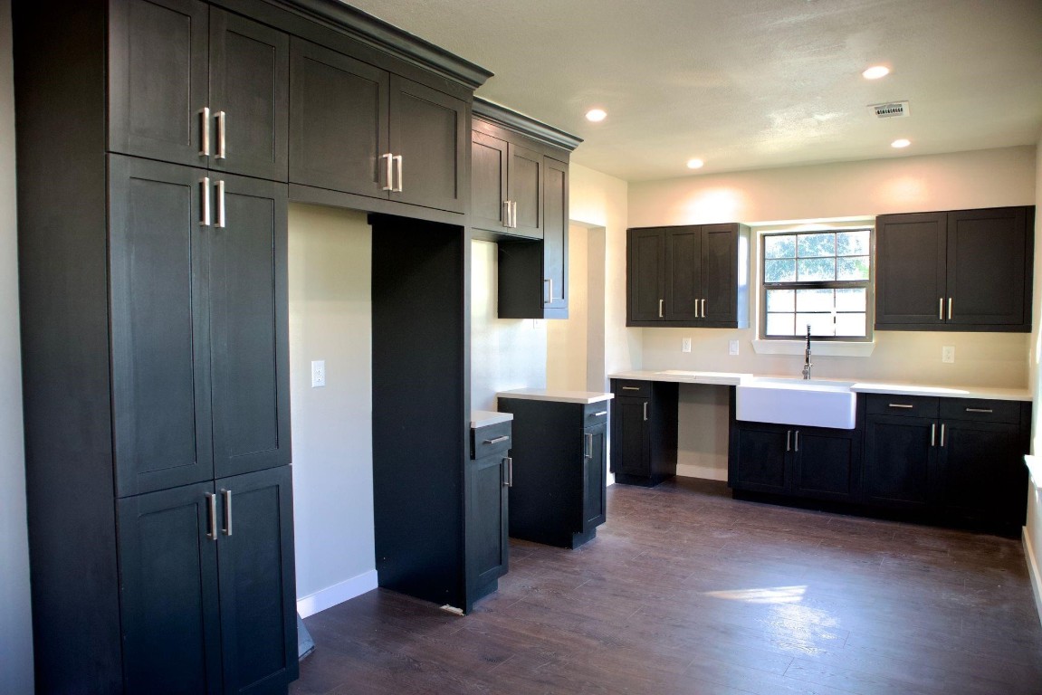 428 Van Molan Street Houston, TX 77022 - Photo 17 of 20 a large kitchen with stainless steel appliances granite countertop a refrigerator and a sink