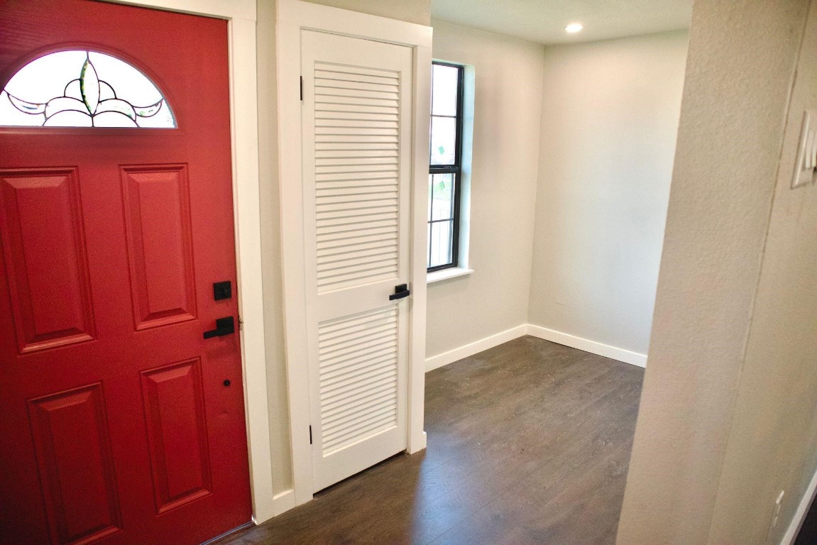 428 Van Molan Street Houston, TX 77022 - Photo 4 of 20 an empty room with wooden floor and a window