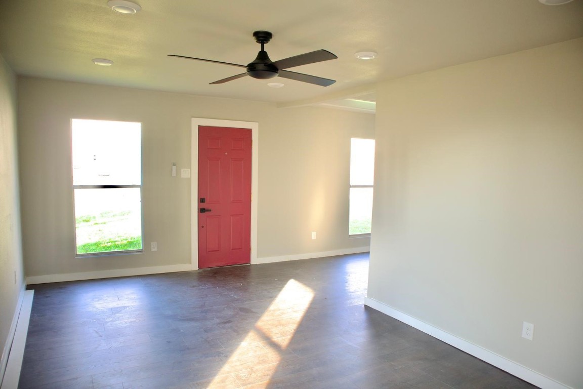 428 Van Molan Street Houston, TX 77022 - Photo 5 of 20 a view of empty room with wooden floor and fan