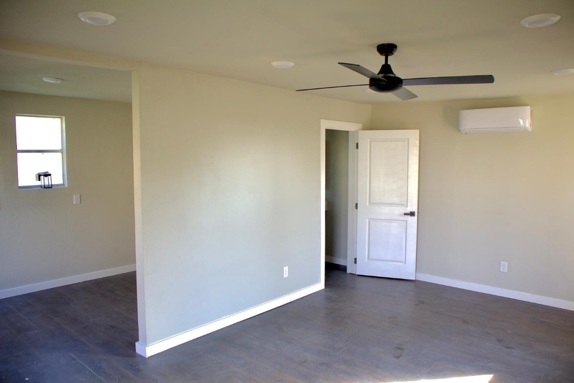 428 Van Molan Street Houston, TX 77022 - Photo 9 of 20 a view of an empty room and wooden floor