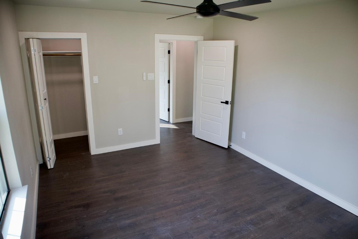 428 Van Molan Street Houston, TX 77022 - Photo 10 of 20 an empty room with wooden floor and closet