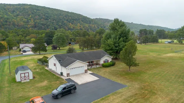 an aerial view of a house with a garden