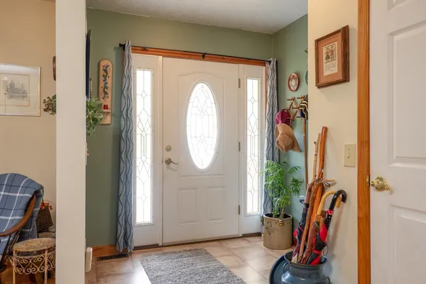 a kitchen with stainless steel appliances granite countertop a sink cabinets and a window