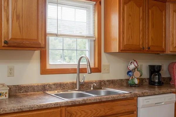 a kitchen with a refrigerator and a stove