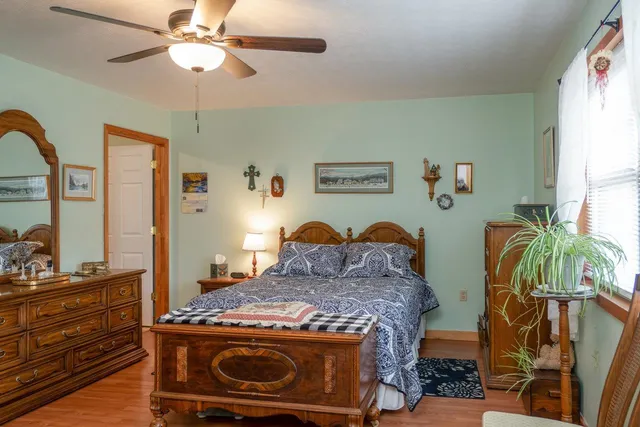 a bedroom with a bed and a dresser