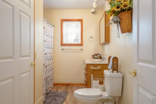 a view of a backyard with a table and chair and wooden floor