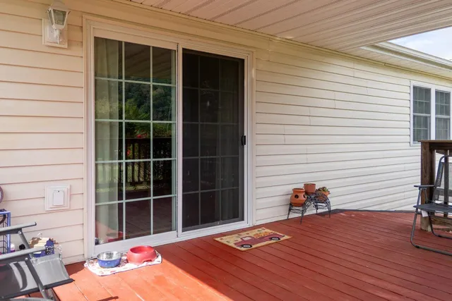 a view of a white house with a yard