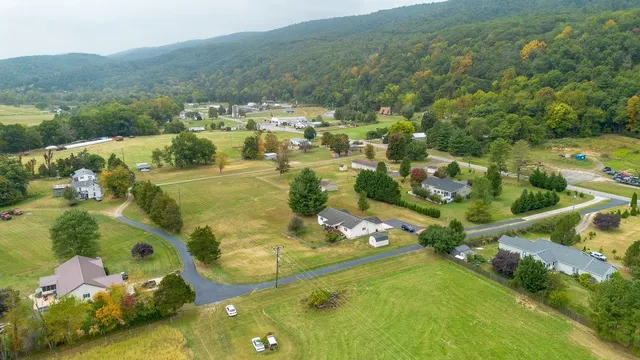 a view of a swimming pool with a yard