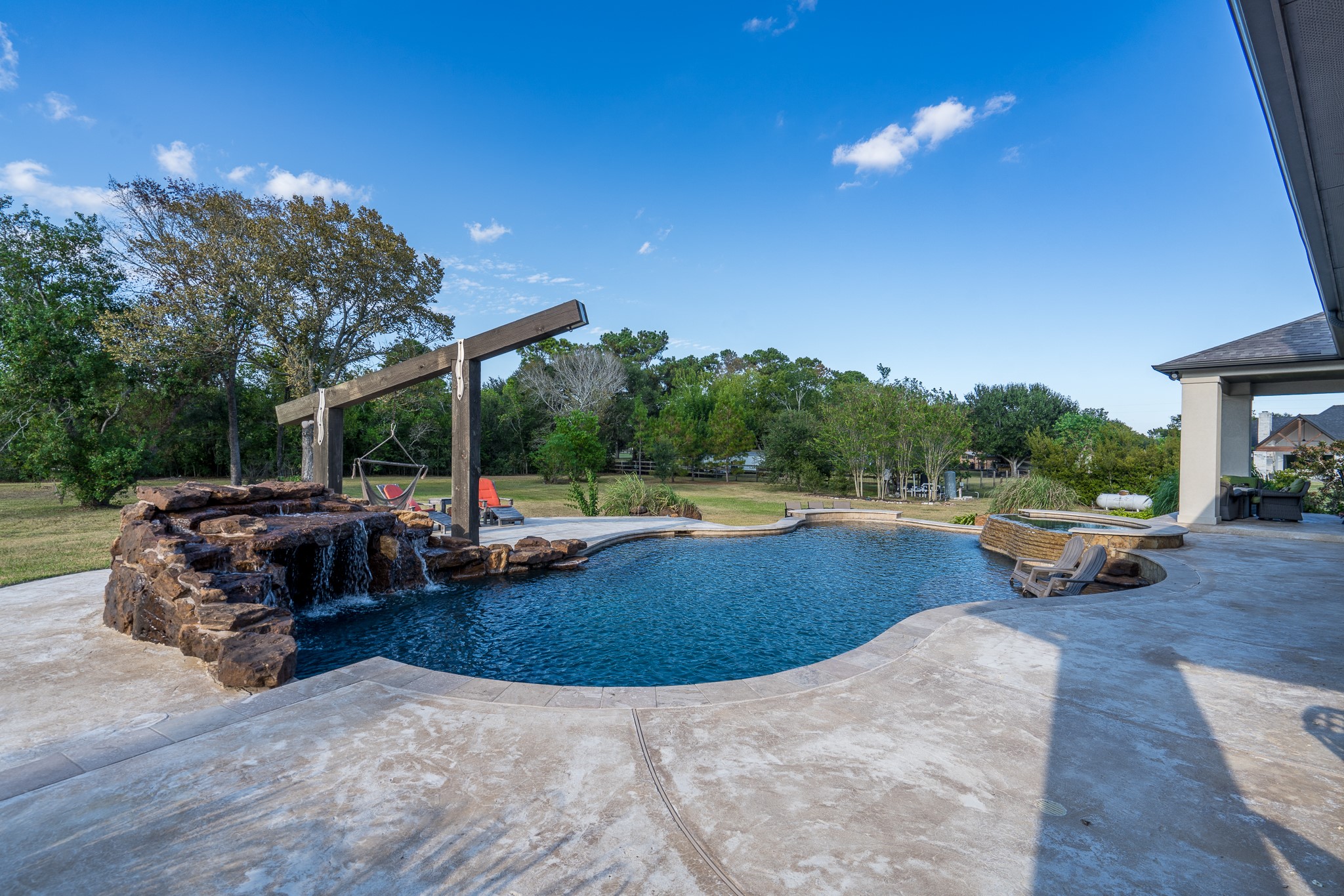 Grotto is conveniently at the deep end which is 9 ft per sellers. Plus, there's a rope swing for making a splash!