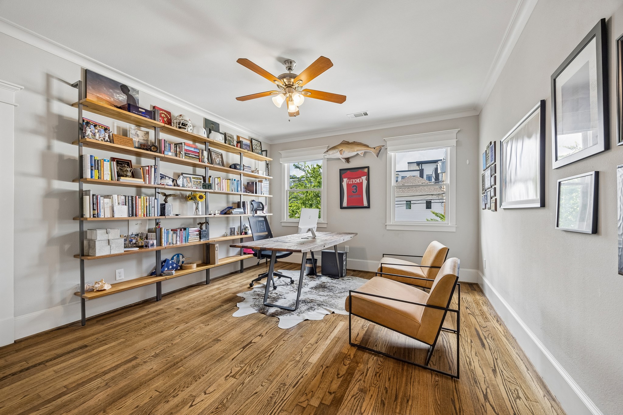 335 West 23rd Street Houston, TX 77008 - Photo 26 of 40 a living room with furniture a rug and a book shelf