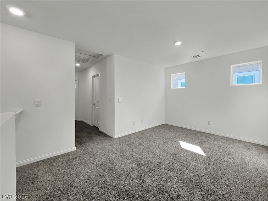 9984 Indigo Cliffs Street Las Vegas, NV 89141 - Photo 19 of 31 Carpeted spare room featuring visible vents, recessed lighting, and baseboards