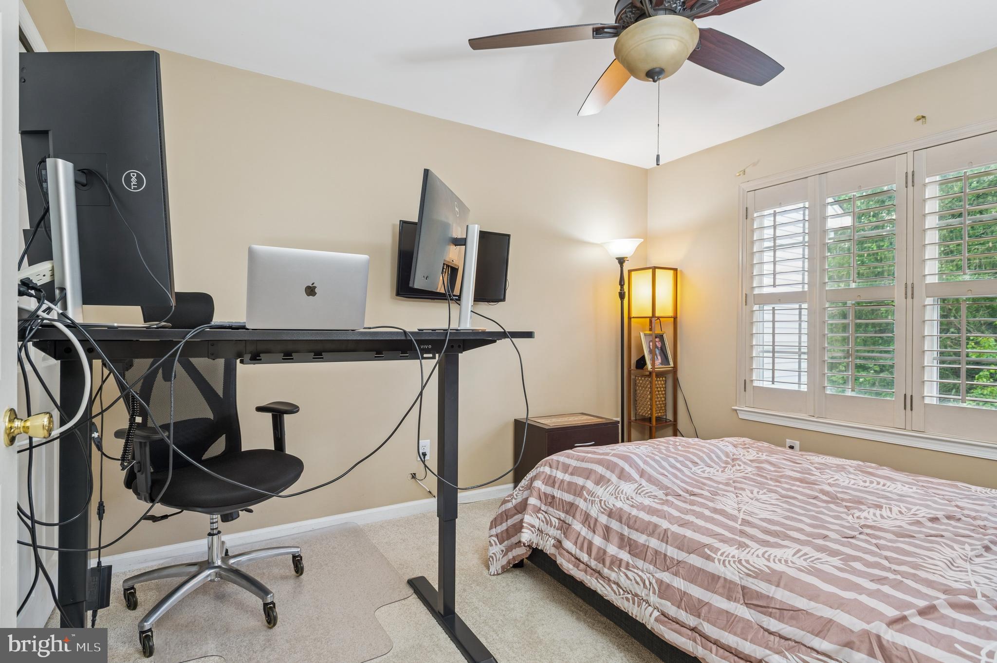 19 York Road Princeton Junction, NJ 08550 - Photo 16 of 19 a bedroom with a bed tv and a chandelier