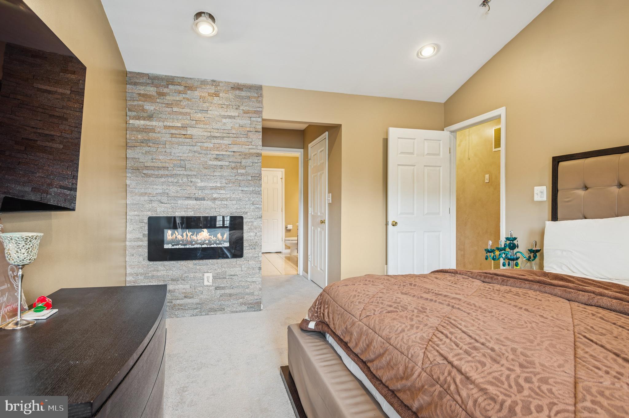 19 York Road Princeton Junction, NJ 08550 - Photo 18 of 19 a spacious bedroom with a bed and a fireplace