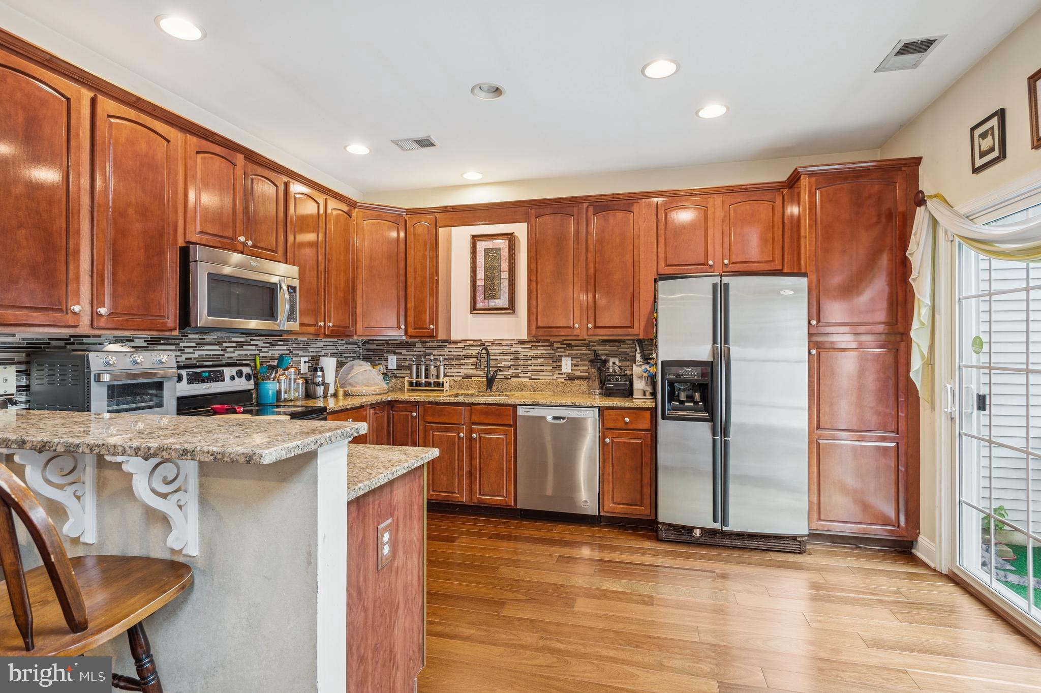 19 York Road Princeton Junction, NJ 08550 - Photo 6 of 19 a kitchen with stainless steel appliances granite countertop a refrigerator stove top oven and sink