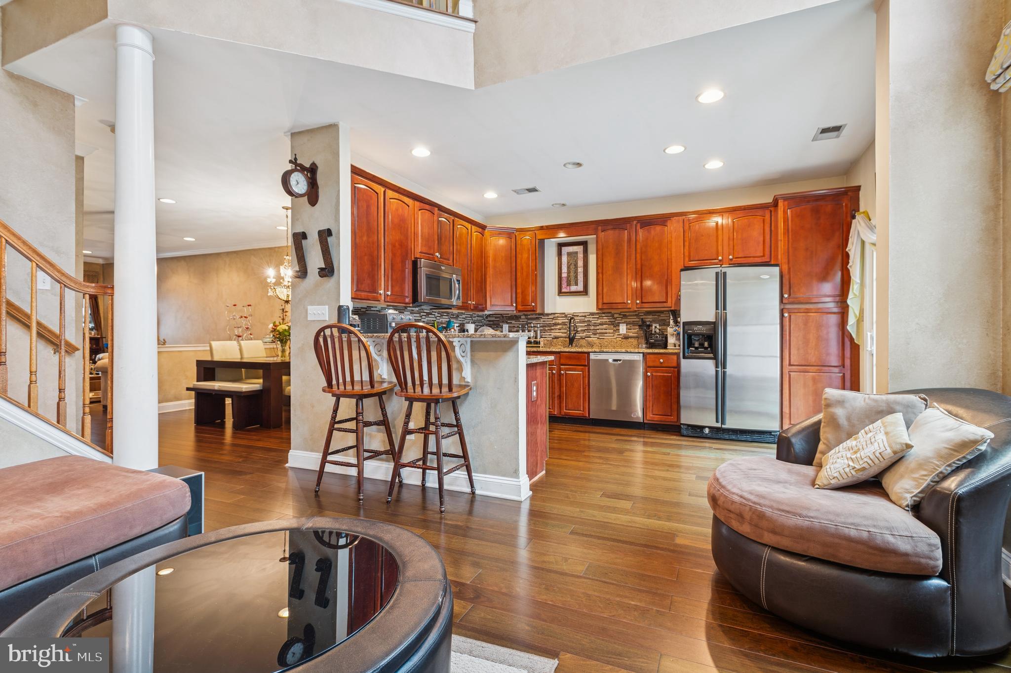 19 York Road Princeton Junction, NJ 08550 - Photo 8 of 19 a living room with furniture a floor to ceiling window and wooden floor