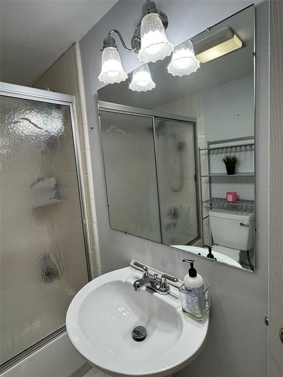 912 Lake Destiny Road, Unit G Altamonte Springs, FL 32714 - Photo 13 of 24 a bathroom with a sink and a mirror