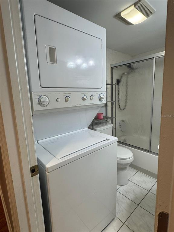 912 Lake Destiny Road, Unit G Altamonte Springs, FL 32714 - Photo 15 of 24 a utility room with dryer and washer