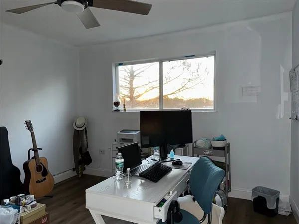 a work room with furniture and a window
