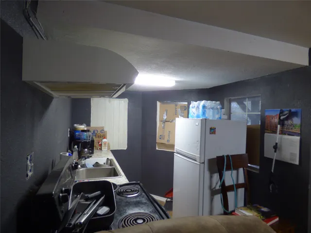 a living room with furniture and a dining room