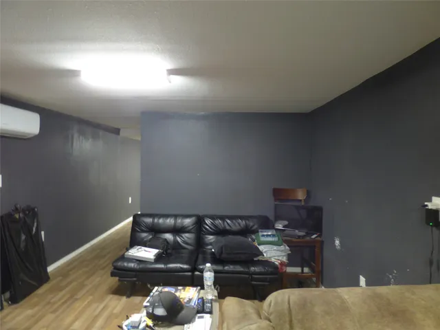 a bathroom with a shower and a curtain