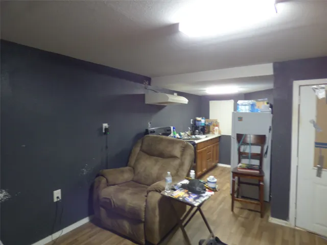 a bedroom with a bed and a mirror