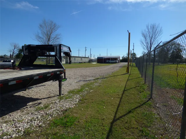 a view of a lake with houses in the back