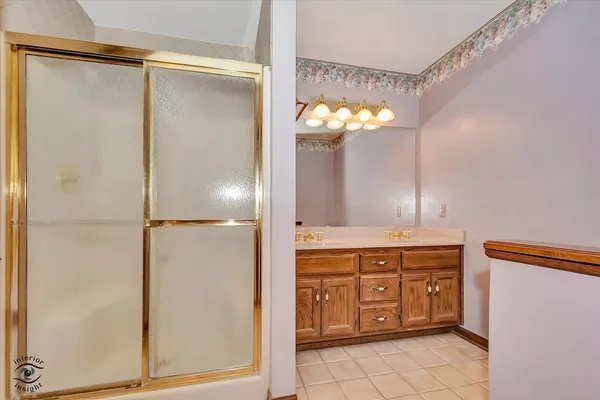 a view of a hallway with stairs