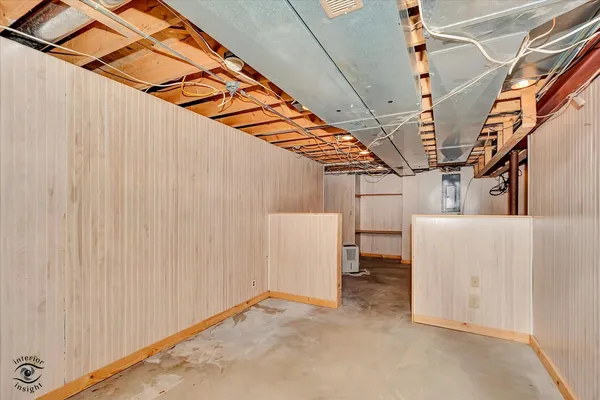 a white house with tree in the background