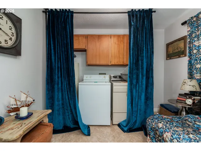 a kitchen with a refrigerator and a window