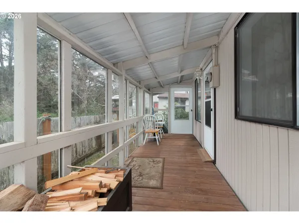 a view of a living room and a wooden floor