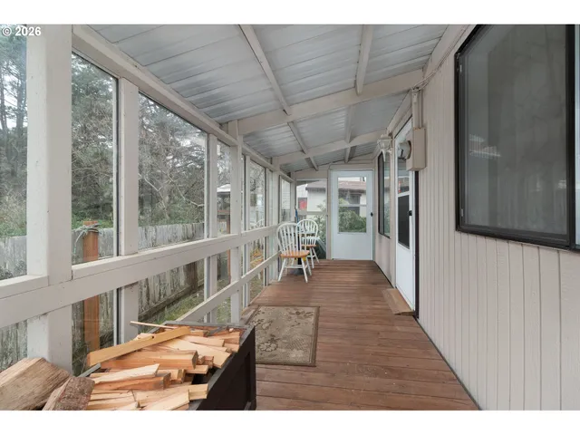 a view of a living room and a wooden floor