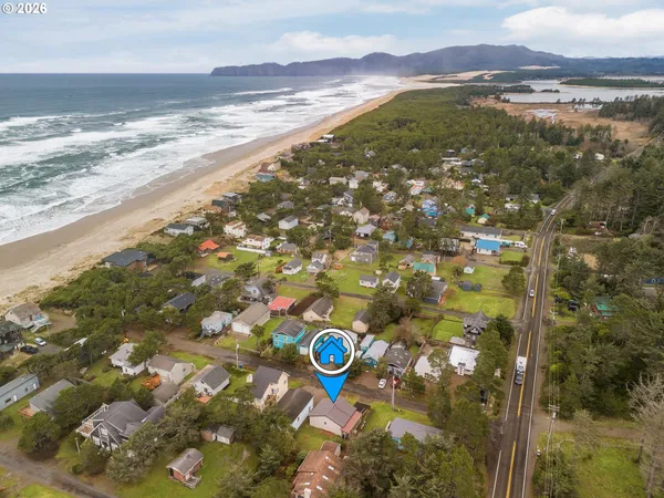 an aerial view of residential houses with outdoor space and street view