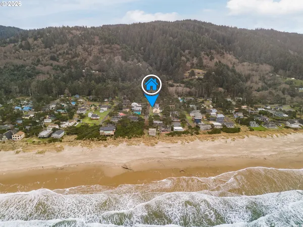 a view of a house with a yard and mountains