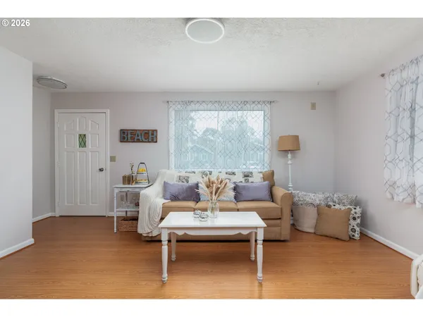 a living room with furniture and a table