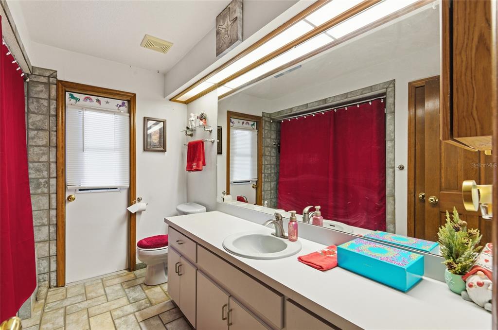 215 Santa Rosa Drive Winter Haven, FL 33884 - Photo 12 of 29 a bathroom with a sink and a mirror