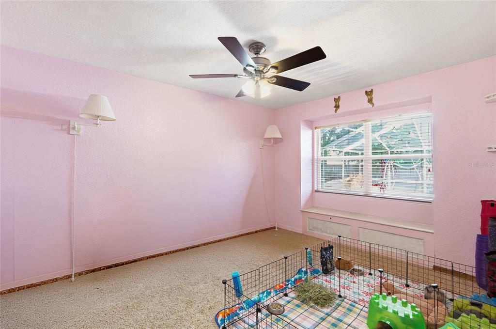 215 Santa Rosa Drive Winter Haven, FL 33884 - Photo 16 of 29 a very nice looking room with a ceiling fan and a window