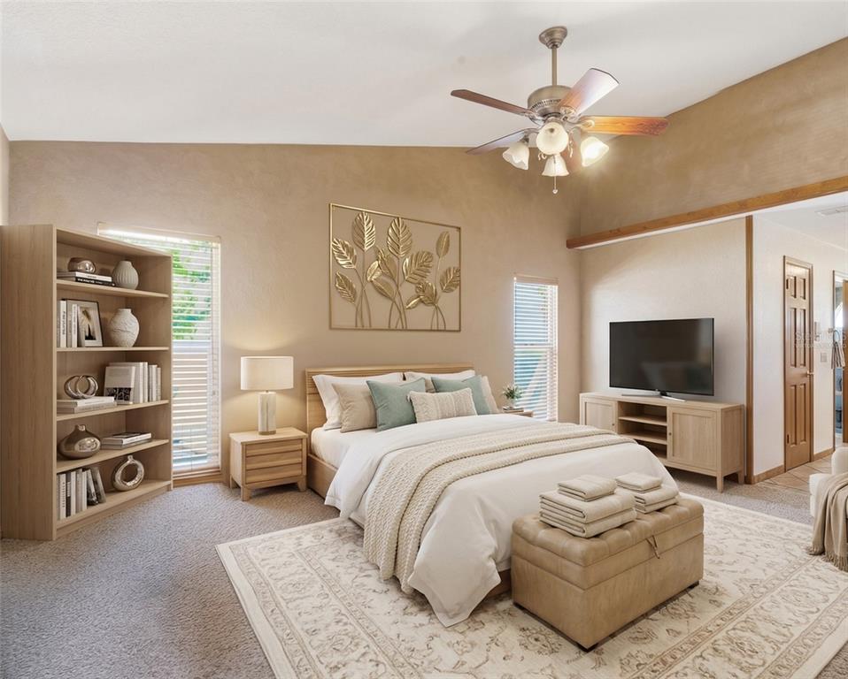 215 Santa Rosa Drive Winter Haven, FL 33884 - Photo 17 of 29 a bedroom with a bed and a flat screen tv
