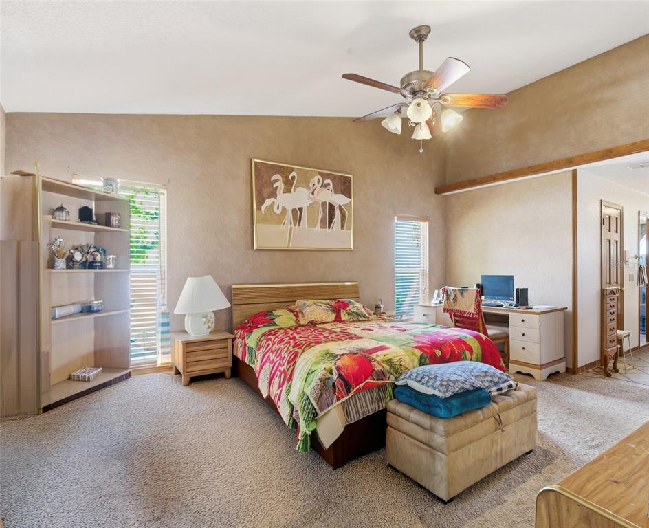 215 Santa Rosa Drive Winter Haven, FL 33884 - Photo 18 of 29 a bedroom with a bed mirror and window