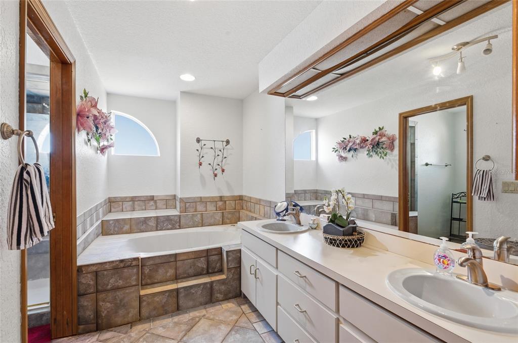 215 Santa Rosa Drive Winter Haven, FL 33884 - Photo 23 of 29 a bathroom with a double vanity sink and a mirror