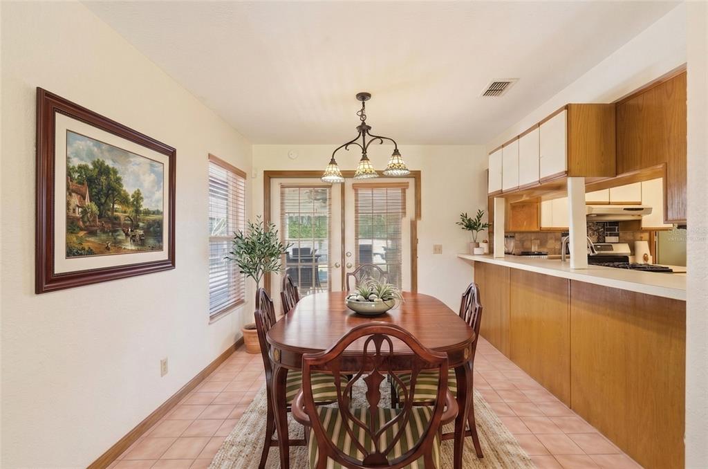 215 Santa Rosa Drive Winter Haven, FL 33884 - Photo 7 of 29 a dining room with furniture window and wooden floor