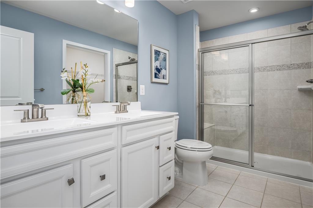 395 Horseshoe Loop Washington, PA 15301 - Photo 12 of 14 a bathroom with a sink toilet and shower