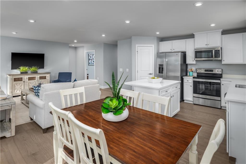 395 Horseshoe Loop Washington, PA 15301 - Photo 7 of 14 a living room with stainless steel appliances furniture a flat screen tv and a kitchen view
