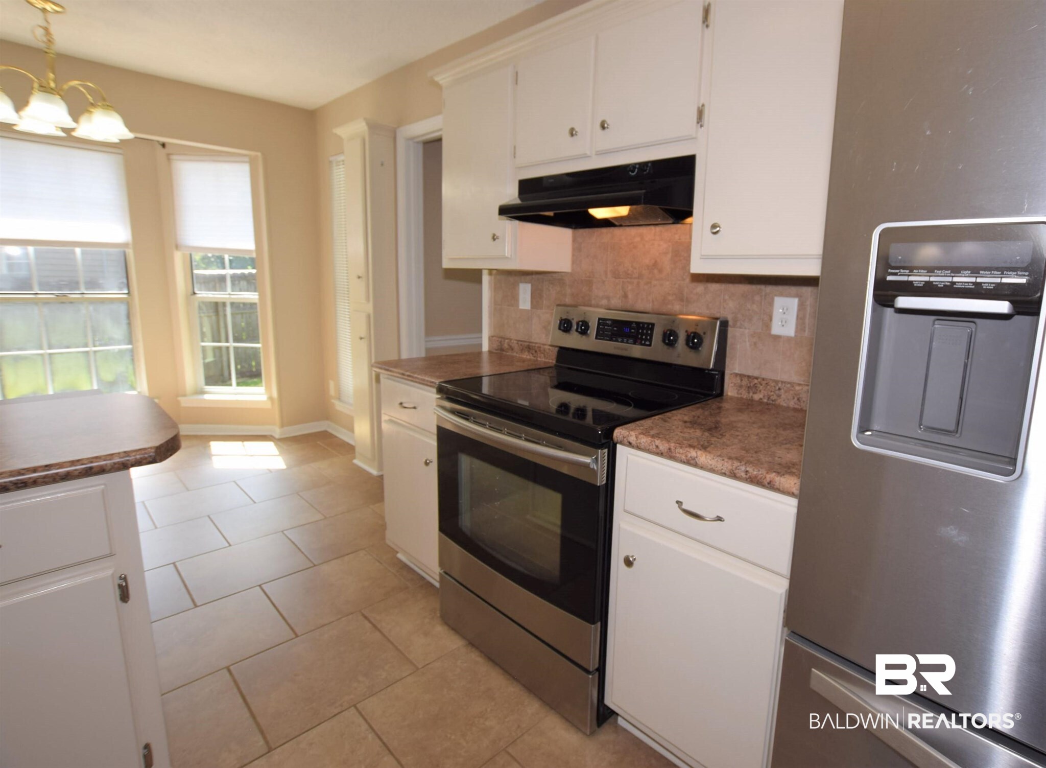 5522 Yucca Drive Mobile, AL 36693 - Photo 6 of 28 Stainless kitchen refrigerator remains.