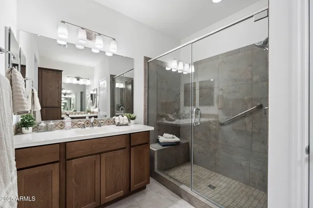 a bathroom with a double vanity sink mirror and double
