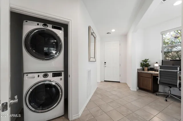 a view of a hallway with washer and dryer