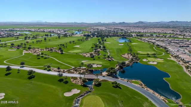 an aerial view of a golf course with a big yard