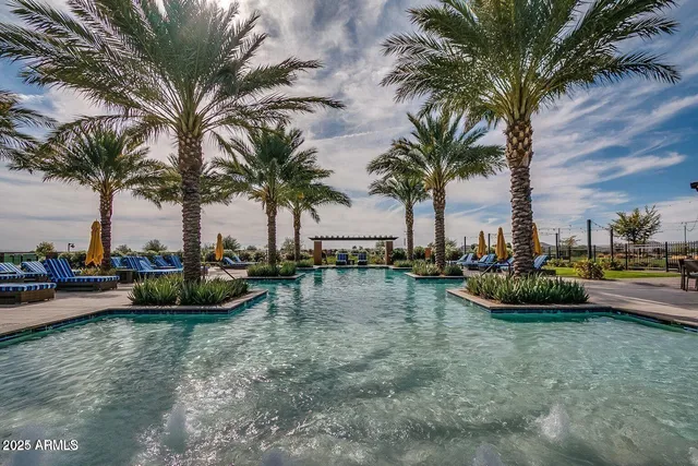 a view of a swimming pool with a table and chairs